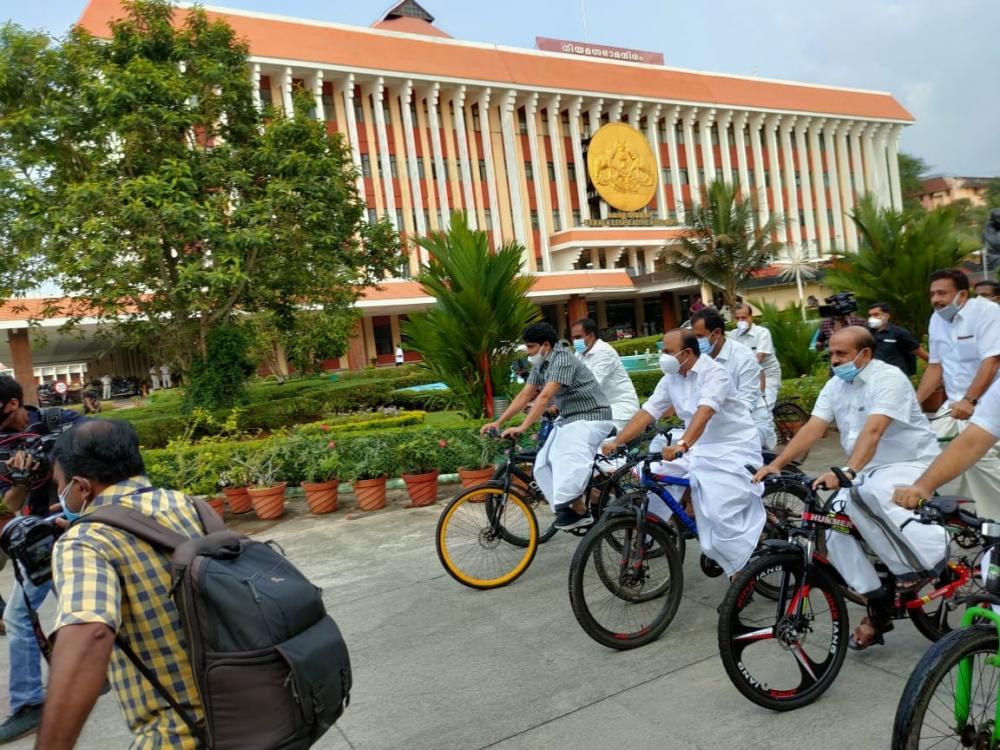 The Weekend Leader - Kerala Oppn MLAs ride bicycles to Assembly in protest